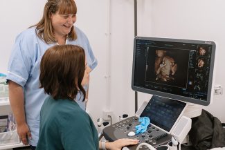Kate Sutcliffe looking at a 4D scanned baby image on the machine at Yorkshire Baby Scan