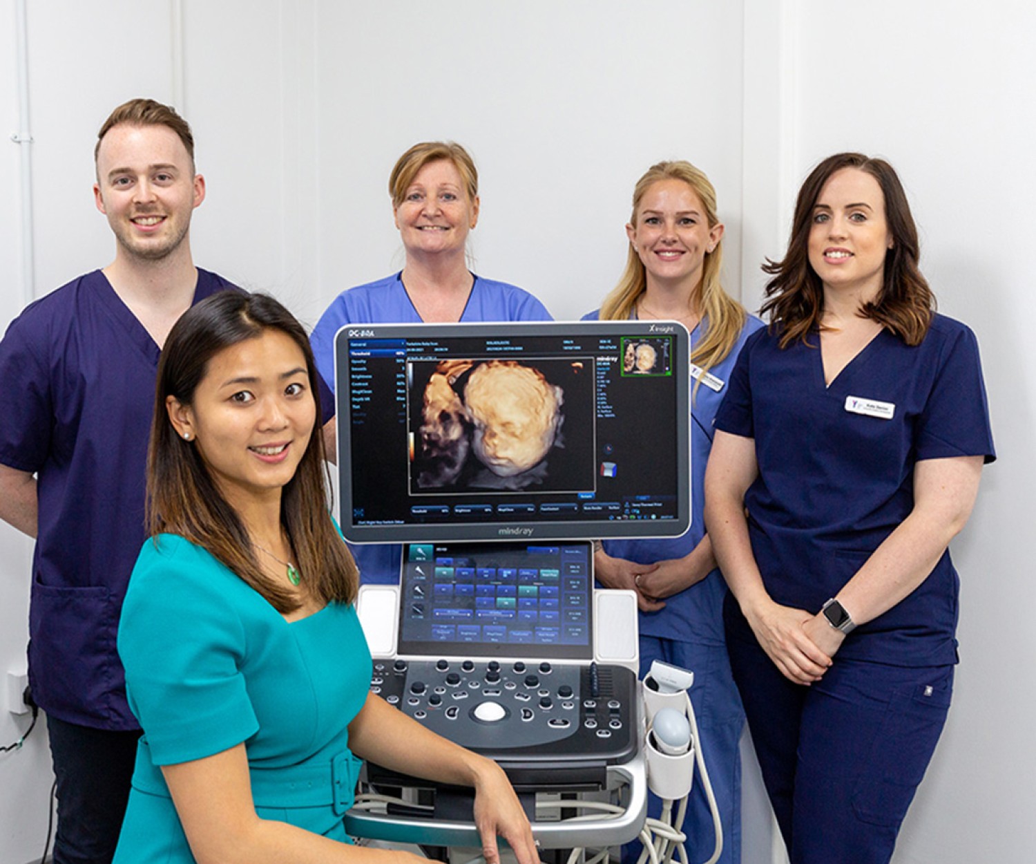 Yorkshire Baby Scan team posing next to an ultrasound scan machine