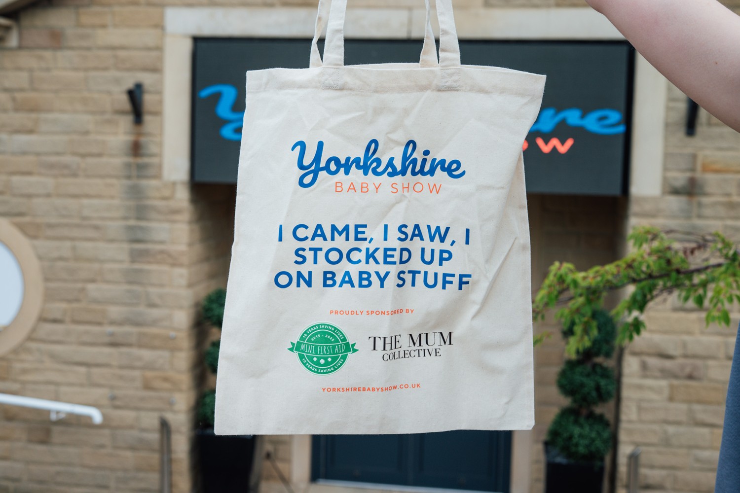 Yorkshire Baby Show event hero image with goodie bag and organiser logo at the entrance