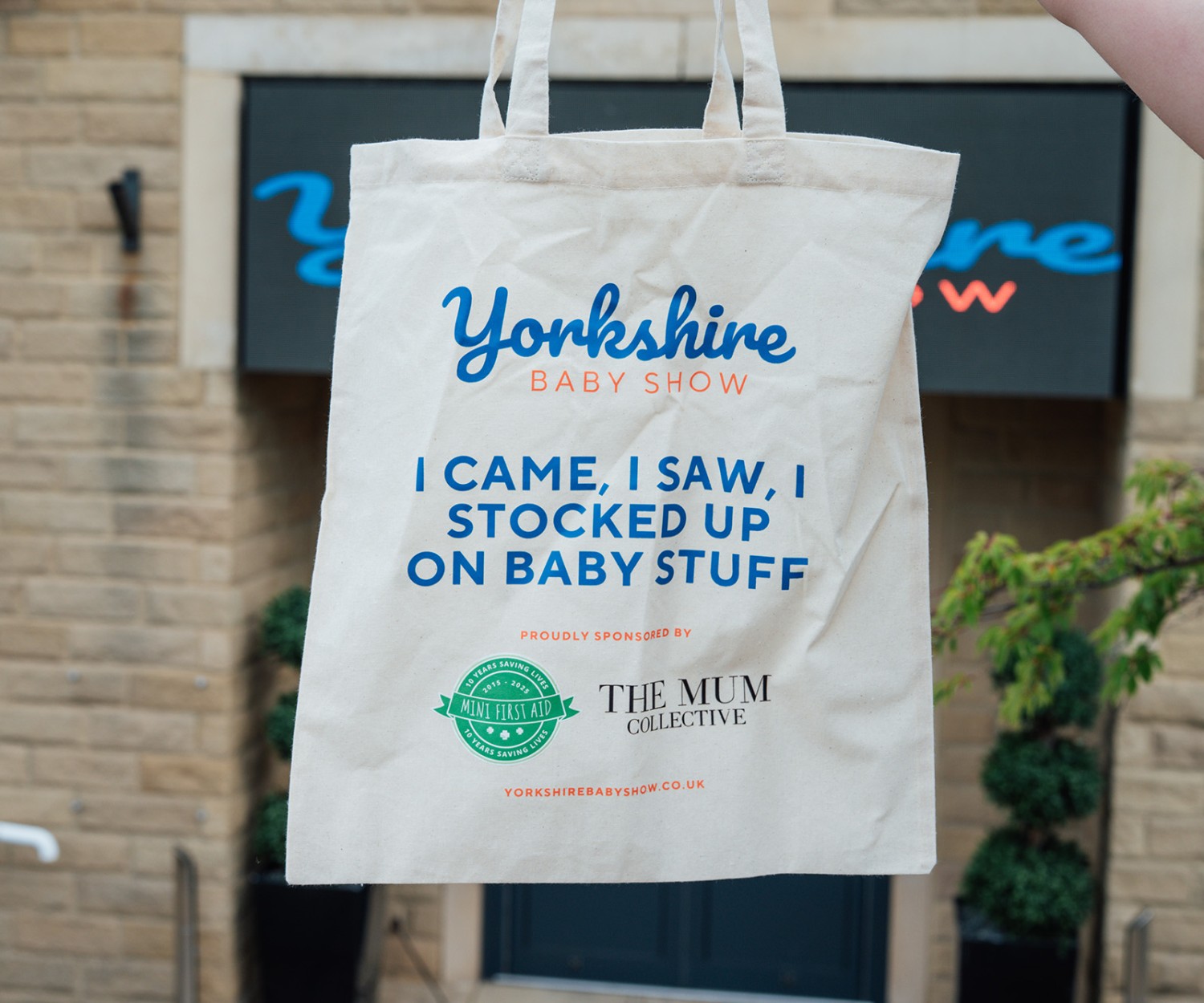 Yorkshire Baby Show event hero image with goodie bag and organiser logo at the entrance