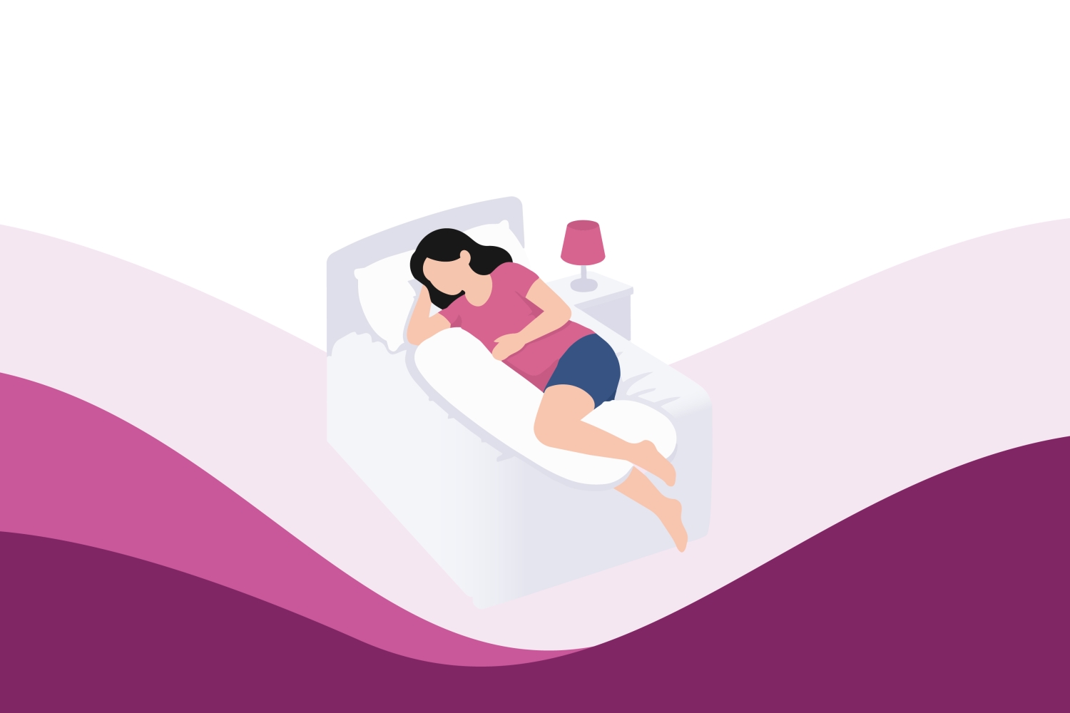 Pregnant woman sleeping comfortably in bed with pillows for support
