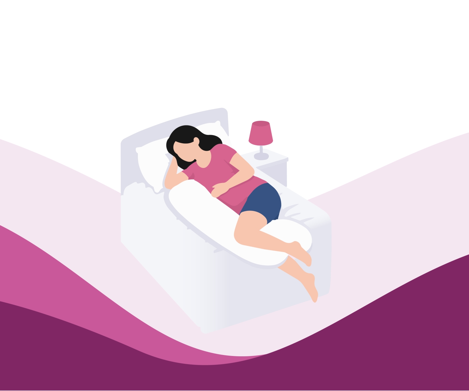 Pregnant woman sleeping comfortably in bed with pillows for support